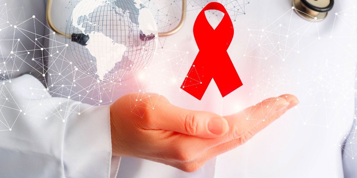 Immagine raffigurante la mano di un dottore con il fiocco rosso dell'AIDS